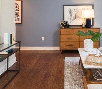 A living room features hardwood flooring